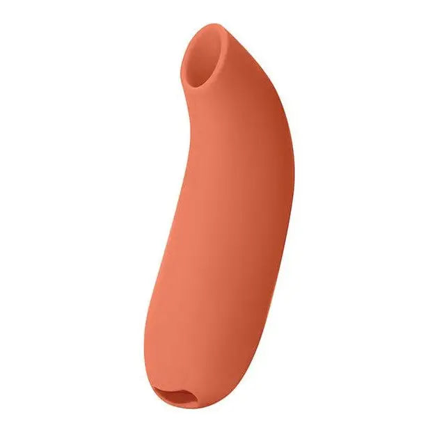 Curved, salmon-colored Dame Aer Suction Toy with openings at both ends