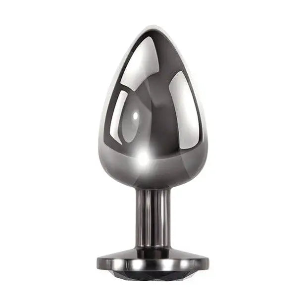 Evolved Black Gem Anal Plug with a black and silver metal candle holder in the background
