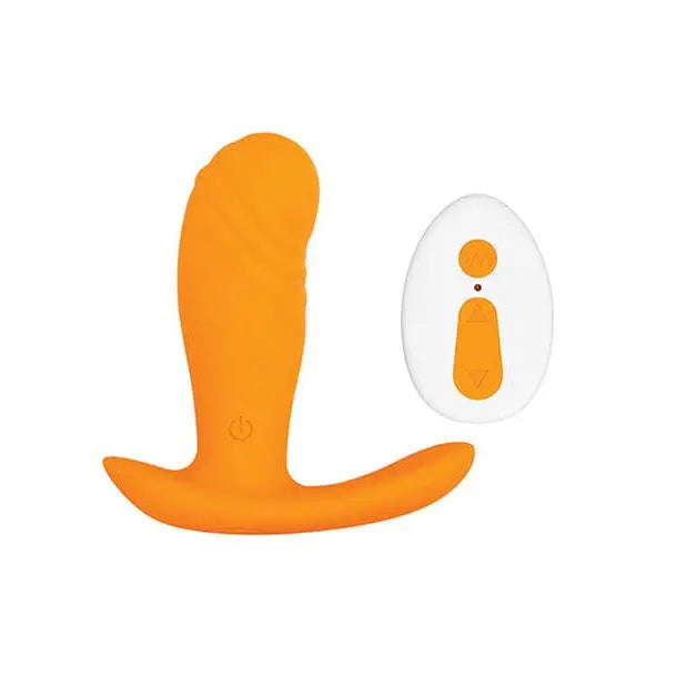 Evolved Creamsicle Plug: orange and white silicone plug with wireless remote