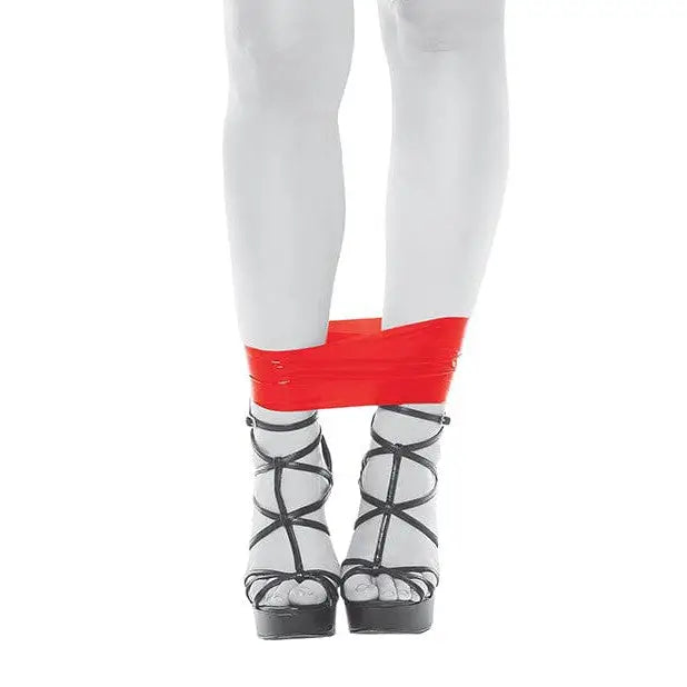 Child with a red knee brace and evolved PVC bondage tape for secure joint support