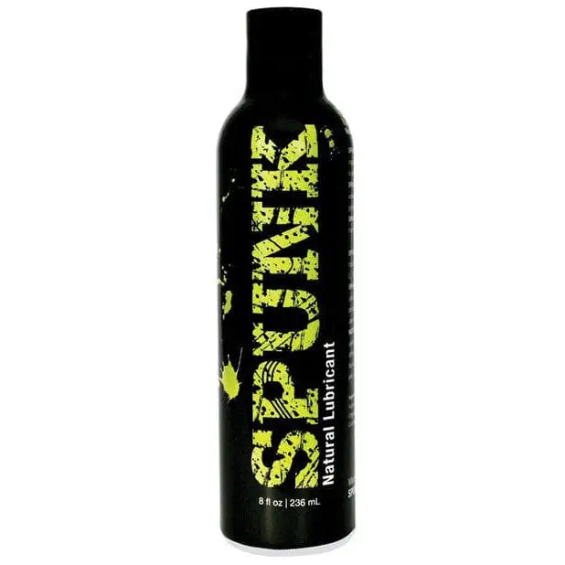 Black bottle labeled ’SPUNK Natural Oil-Based Lube’ with ’Spunker’ in green splattered text