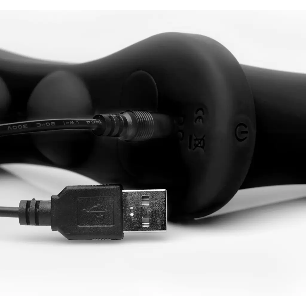 USB cable connected to a computer for Strap U Double Penetration Vibrating Strap On Harness