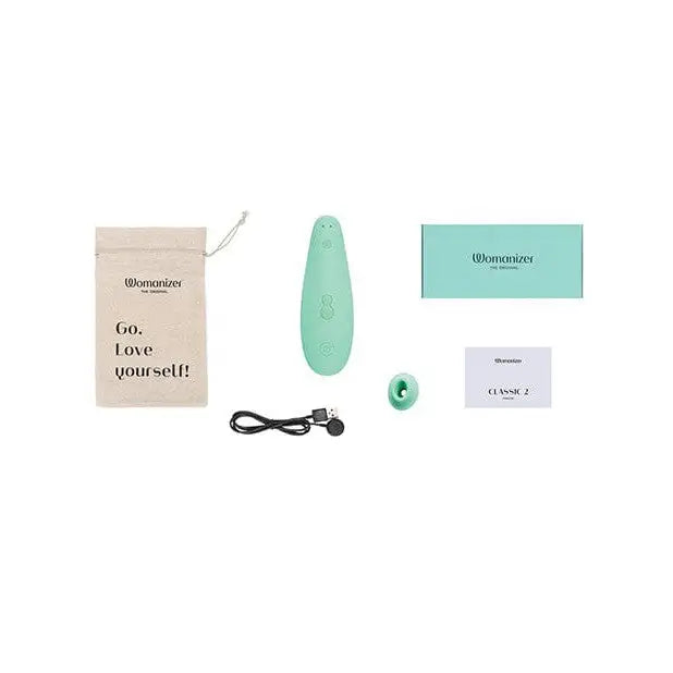 Mint green Womanizer Classic 2 Monroe Special Edition massager, egg-shaped with buttons