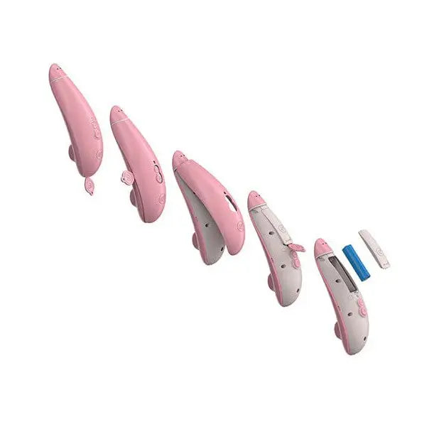 Womanizer PREMIUM Eco Air Clitoral Stimulator in pink and white with three hair clipper blades
