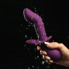 Purple 10x G-spot silicone vibrator with splashing water droplets and flanged base