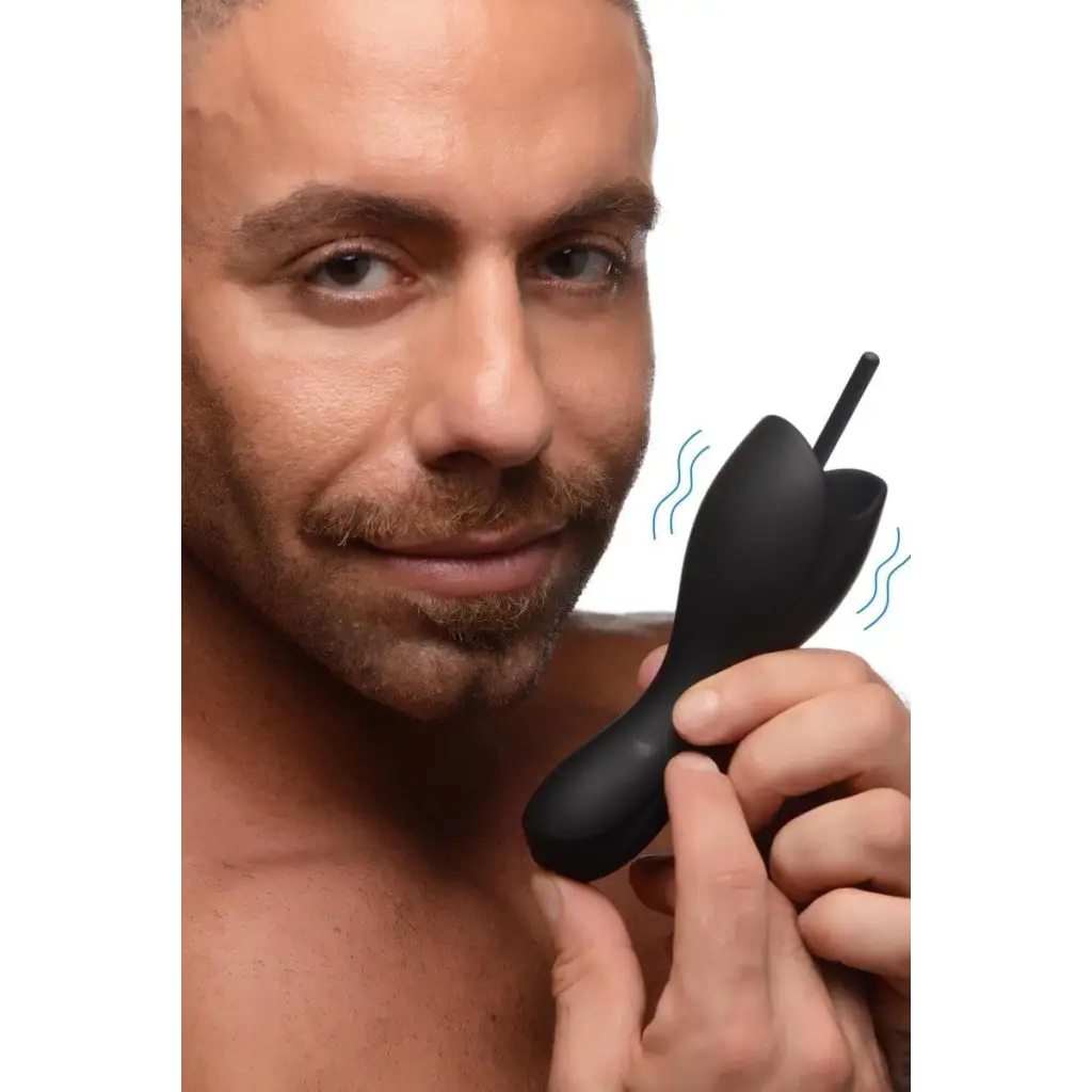 A man using an electric shaver with the 10x Vibrating Penis Head Teaser With Urethral Sounds