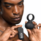 Man holding ear buds from the 28x Vibrating Balls product collection