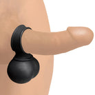 A person using 28x Vibrating Balls, featuring a black ball attached to their butt