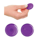 Close-up of a hand holding a purple button for the 3some Rock N’ Ride toy