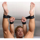 Person using 4 Cuff Adjustable Hog Tie Restraint Strap with arms raised and feet bound