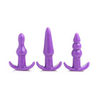 Three purple silicone anal plugs with flared bases from our 4 Piece Vibrating Anal Plug Set