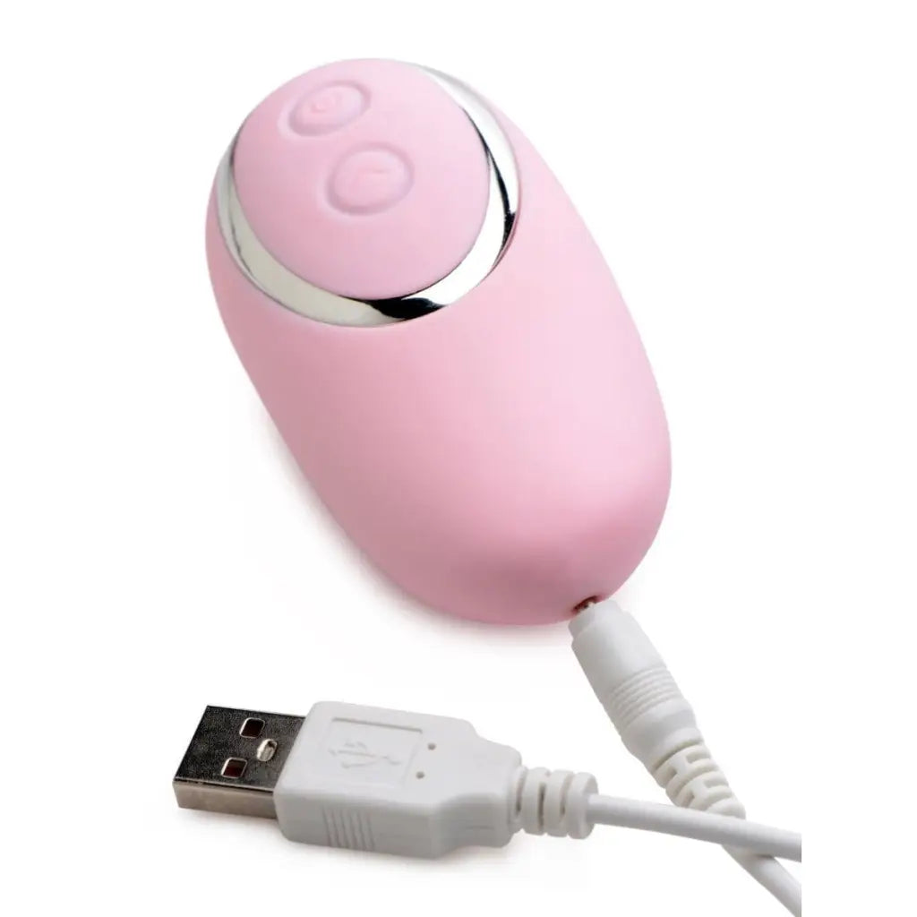 Pink egg-shaped pulsing silicone clit stimulator with USB charging cable and silver top