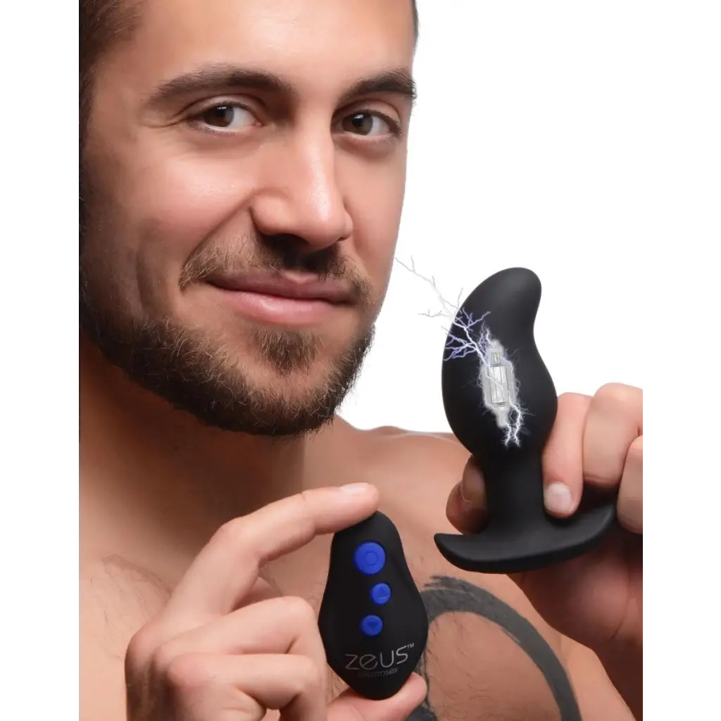 Man smiling with 8x Volt Drop Vibrating E-stim Silicone Prostate Massager and remote control