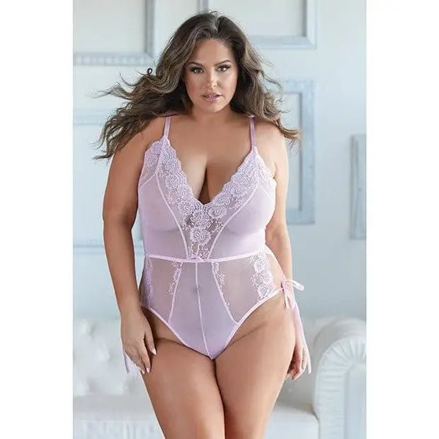 Allure Belle lace & mesh tie romper worn by a curvy woman with long wavy hair