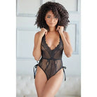 Allure Belle Lace & Mesh Tie Up Romper worn by woman with curly hair