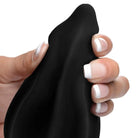 Hand holding the Assterisk 10X Ribbed Silicone Vibrating Butt Plug with manicured nails