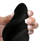 Hand holding Driller 10X Swirled Silicone Vibrating Butt Plug with manicured nails