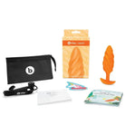 The b-Vibe Medium Texture Plug includes a pouch, a vibe medium texture plug, and scissors