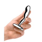 Hand holding b-Vibe stainless steel prostate plug for enhanced pleasure