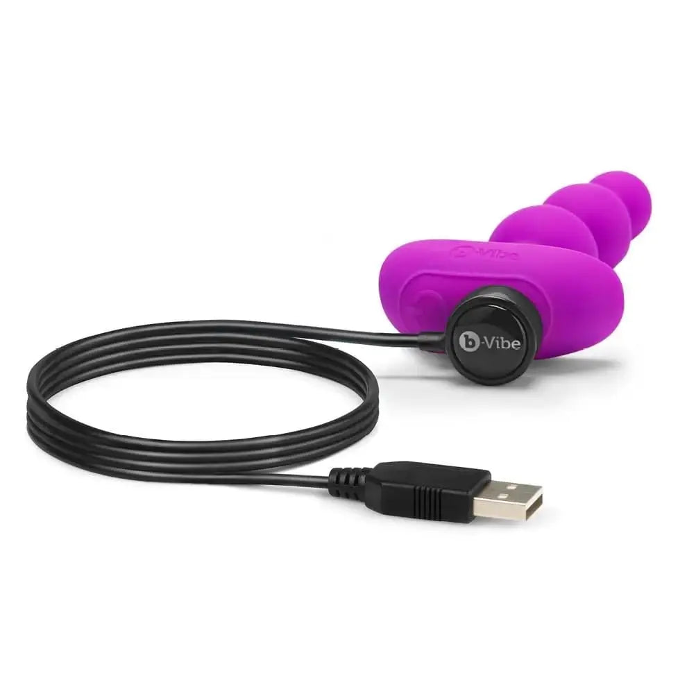 Purple earphone with a cable and black cord from b-Vibe Triplet Anal Beads collection