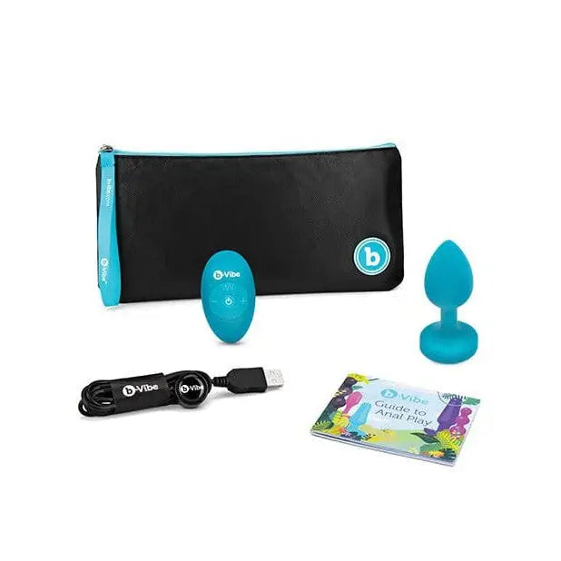 b-Vibe Vibrating Jewel Plug next to black bag, perfect for discreet pleasure and travel