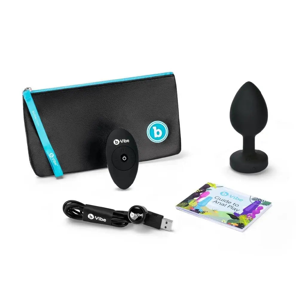 Black and blue b-Vibe Vibrating Jewel Plug with a blue case, luxurious jewel plug design