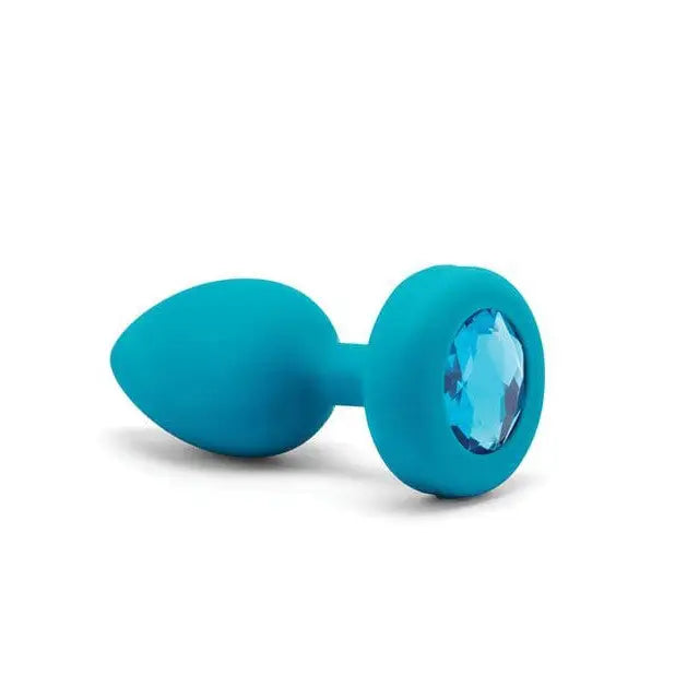 Turquoise silicon ear plugs from b-Vibe Vibrating Jewel Plug for discreet comfort and style