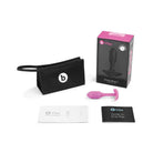 Close-up of pink b-Vibe Weighted Snug Plug 1 in black box with smooth grip handle