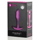 Pink vibrating snug plug with smooth black handle from b-Vibe Weighted Snug Plug 1 - 55g