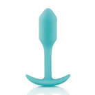 b-Vibe Weighted Snug Plug 1 with a blue silicone curved handle for a smooth grip