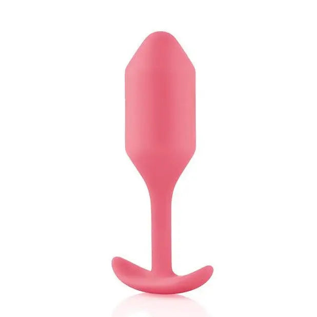 b-Vibe Weighted Snug Plug 2 - 114 Grams with a pink plastic spoon handle