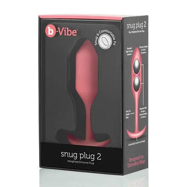 Close-up of b-Vibe Weighted Snug Plug 2 in a box, featuring a pink vibrating device