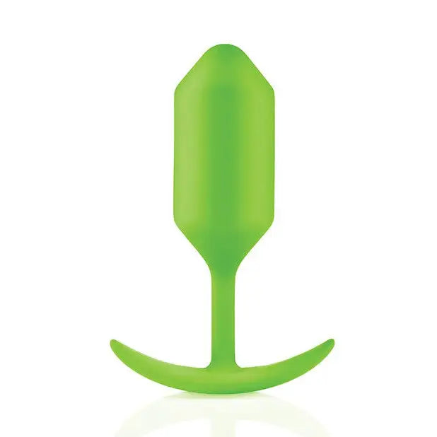 Green plastic spoon resembling the b-Vibe Weighted Snug Plug 3, ideal for snug plug enthusiasts