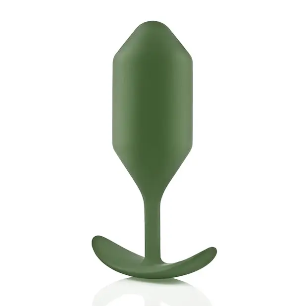 Close up of green b-Vibe Weighted Snug Plug 4 with smooth grip handle and flexible neck