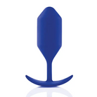 Blue plastic spoon with smooth grip handle, showcased with b-Vibe Snug Plug 4 - 257 grams