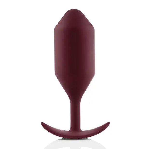 b-Vibe Snug Plug: Red plastic, wine bottle-shaped weighted butt plug with a curved top