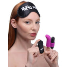 Woman using sleep mask, holding vibrators from BANG! 28X Couple’s Kit for intimate pleasure