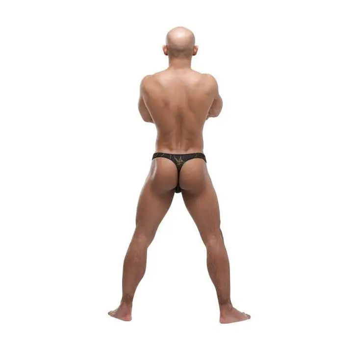 Bald, muscular man in a black gold thong, viewed from behind. Shop the Black Gold Thong now!