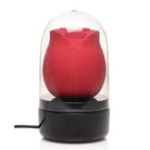 Bloomgasm Wild Rose 10x Stimulator in a glass dome display case with power cord