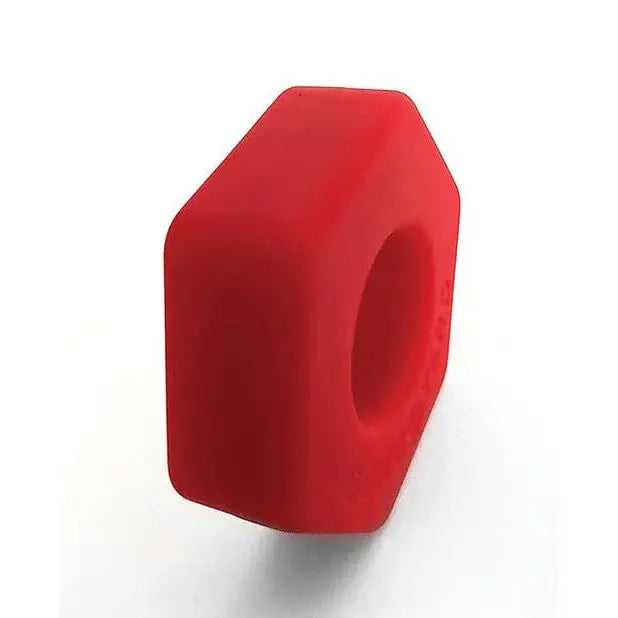 Red rubber block featured in the Boneyard Bust A Nut Cock Ring product display