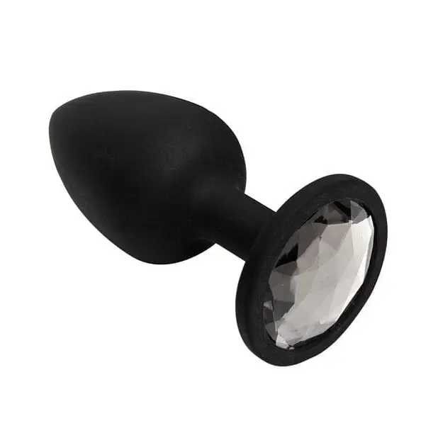 Booty Bling: A sleek black plastic knob with a white face for stylish adult play