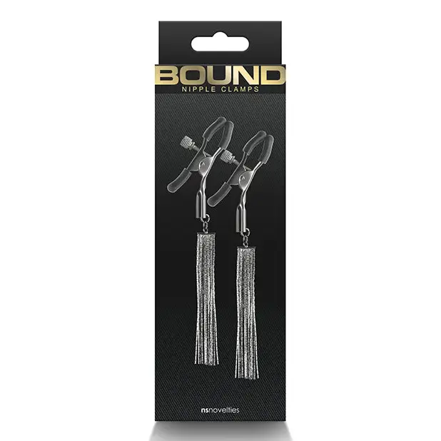 A pair of silver earrings with tassels, resembling Bound Nipple Clamps, on black background