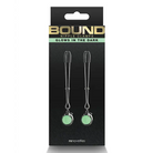 Glow in the dark earrings with Bound Nipple Clamps C3 Gunmetal on a black background