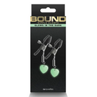 The Bond Supply glow-in-the-dark heart earrings with Bound Nipple Clamps C3 Gunmetal