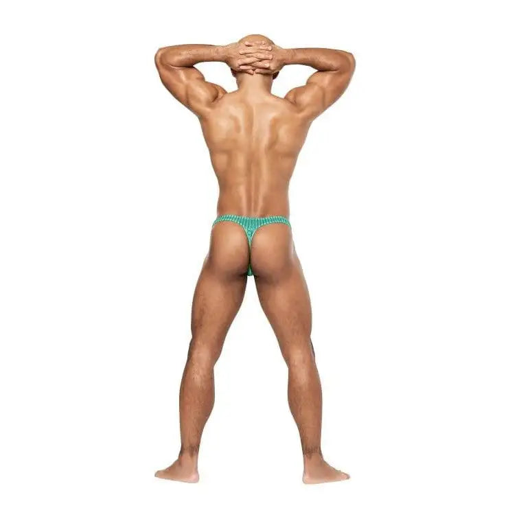 Muscular man in Caribbean Crush Thong underwear, hands behind head, showcasing green thong