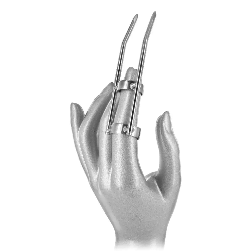 Silver hand sculpture with metal prongs for Cat Claw Skin Scratcher product