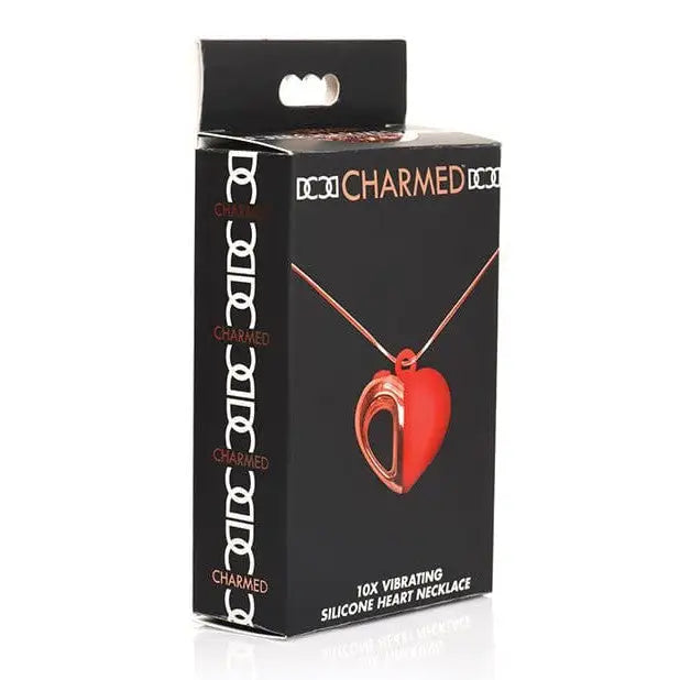 Charmed 10x Vibrating Silicone Heart Necklace in packaging - red heart-shaped pendant