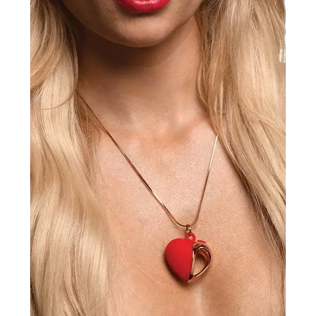 Charmed 10x Vibrating Silicone Heart Necklace – Red heart-shaped pendant with gold-toned half