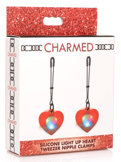 Charmed Nipple Clamp Red Charmed Silicone Light Up Heart Tweezer Nipple Clamps at the Haus of Shag