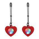 Heart-shaped red LED pendants on tweezer nipple clamps for a charming intimate touch